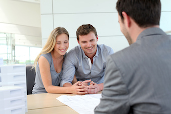 couple meeting with Kelowna real estate agent 
