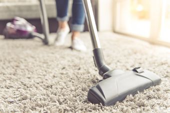 lady vacuuming Kelowna home