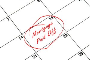 calendar with date circled saying "mortgage paid off"