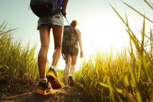 couple hiking up a hill 