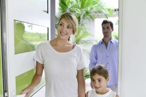 family walking into their Kelowna home