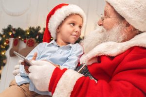 Sensitive Santa event held in Kelowna, young boy sitting on Santa lap