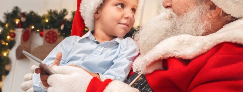 Sensitive Santa event held in Kelowna, young boy sitting on Santa lap