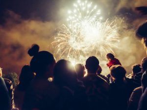 group of friends gathered watching the firework display