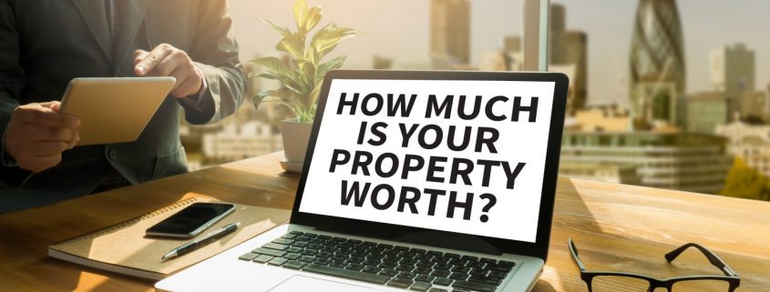computer with "how much is your property worth" on the screen