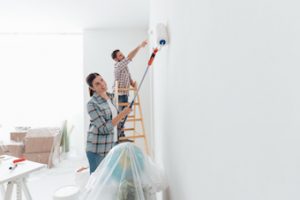 couple painting their room white