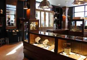 posh jewelry store displaying jewelry in cases