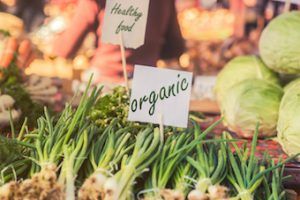 organic labelled green onions at a market