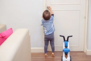 toddler opening door in Kelowna real estate