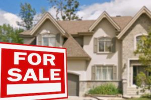 house for sale with sign in front lawn