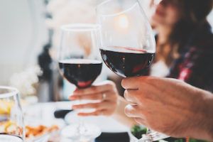 couple enjoying a glass of red wine