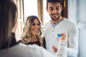 couple getting handed keys to their new Kelowna home 