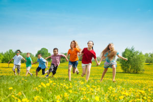 children running around in park in Kelowna