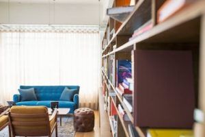 Kelowna downtown condo with bookshelf in living room 