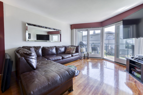 205-4058 Lakeshore Road - bright condo living room- QVA