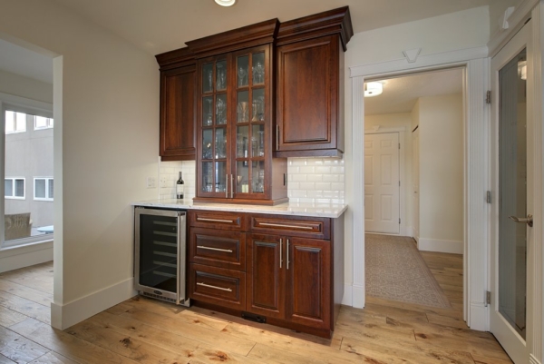Built-in wine fridge with extra cabinetry for glasses, storage in 2650 Lakeview